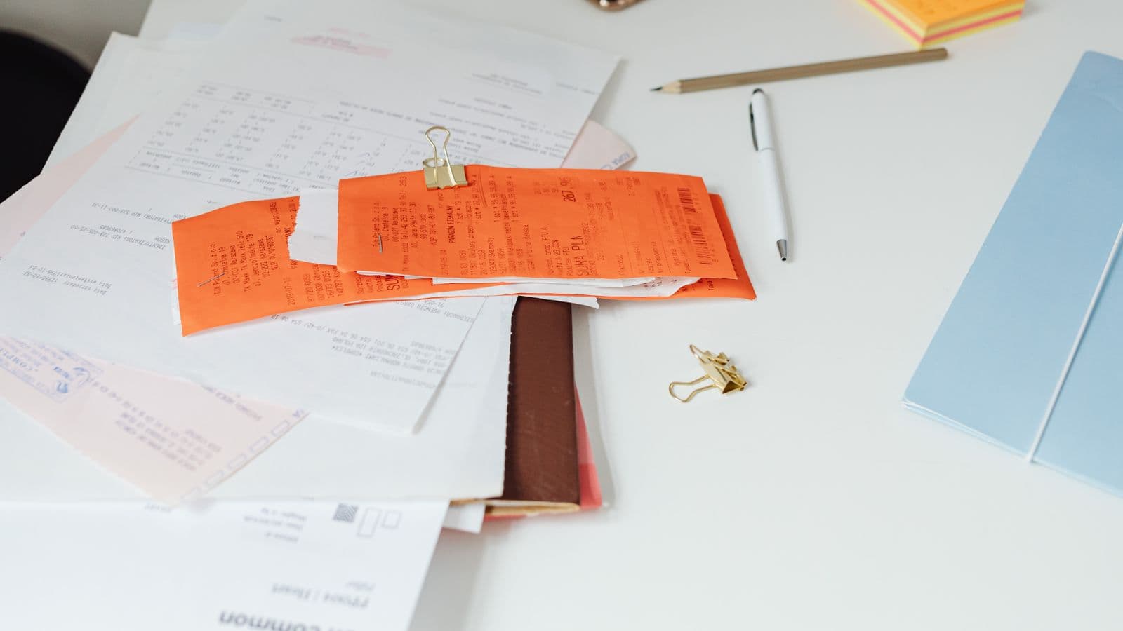 An accounts receivable aging report and general ledger control account balance being compared side by side during reconciliation